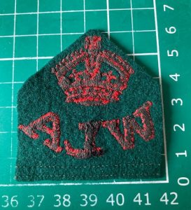 Reverse of Women's Land Army cloth badge